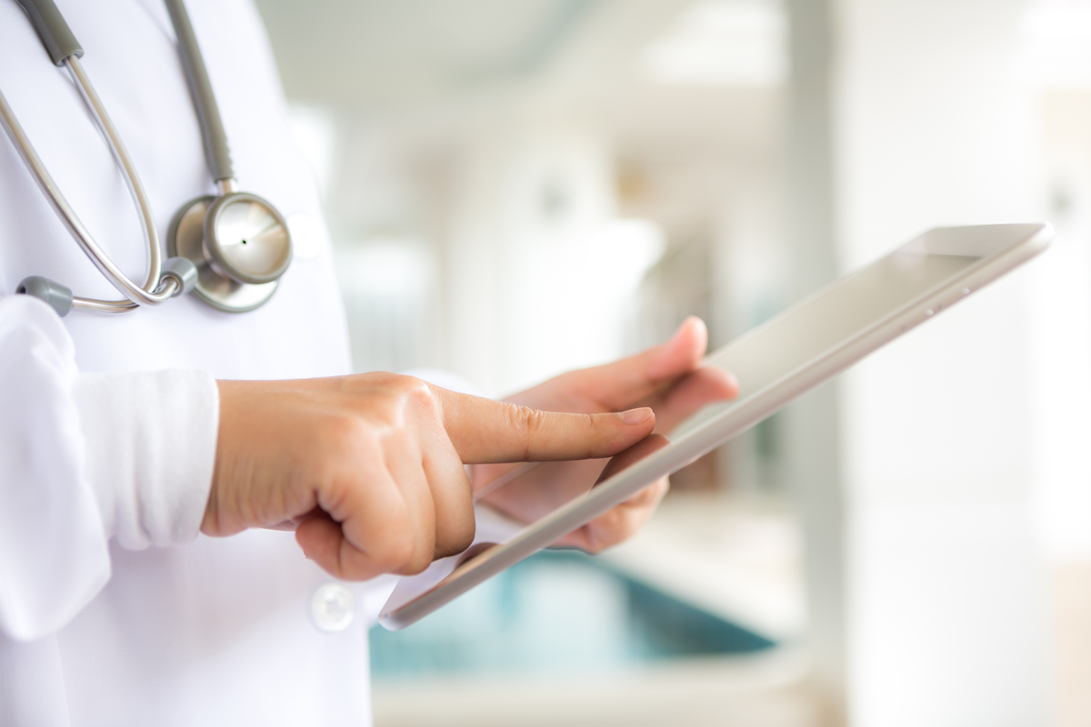 close-up-specialist-using-tablet